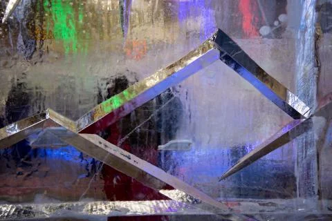Background with transparent multicolored ice Stock Photos
