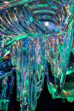 Background with transparent multicolored ice Stock Photos