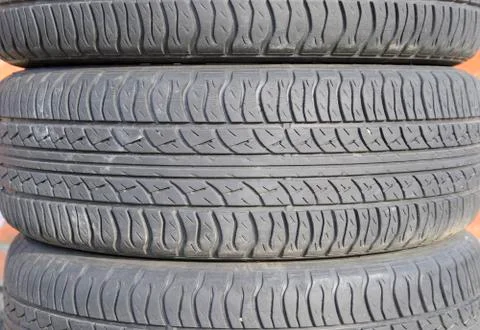 The background of the tread pattern of the car wheel. Rubber tir Stock Photos