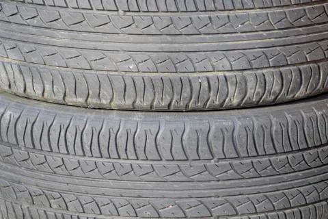 The background of the tread pattern of the car wheel. Rubber tir Stock Photos