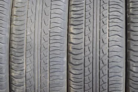 The background of the tread pattern of the car wheel. Rubber tir Stock Photos