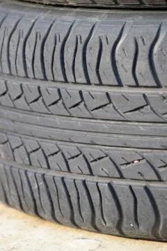 The background of the tread pattern of the car wheel. Rubber tir Stock Photos