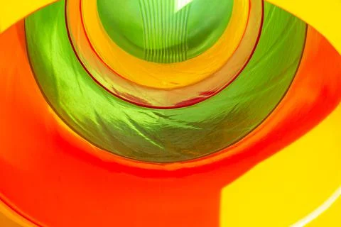 Background. The tunnel is visible from the inside in different colors. Stock Photos