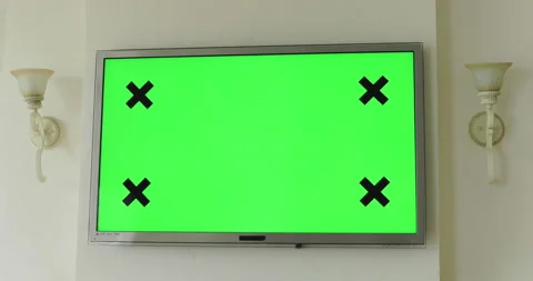 Background of TV plasma with green screen hangs on a wall Video stock 130436339