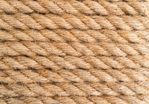 Background twisted rope. Rope texture. Brown and yellow rope texture. Old vin Stock Photos