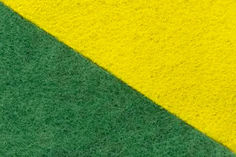 Background of two colored green and yellow non-woven fibrous abrasive materia Stock Photos