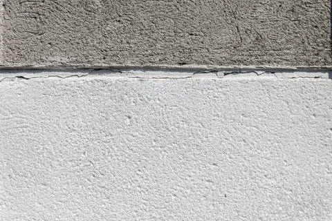Background two-tone concrete, light and dark gray, divided in half Stock Photos