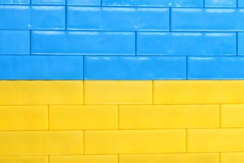 Background Ukraine Flag brick wall, childish cubes. Bright toys Stock Photos