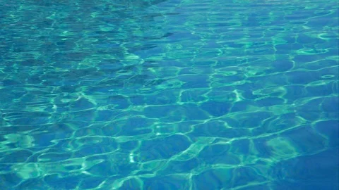 Background of the undulating surface pool water. The rays of the sun Stock Footage 91599261