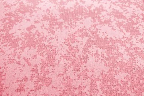 Background of unevenly colored light red surface, texture close-up Foto stock