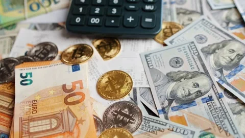 Background with US Dollar and Euro bills, BTC bitcoins and bills to pay. Stock-Footage 346728462