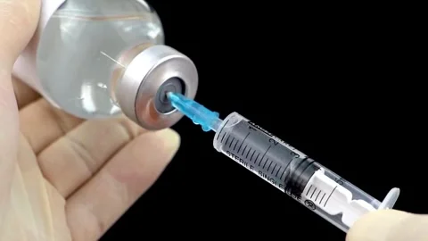 Background Using modern drugs Doctor preparing vaccine injection in modern Stock-Footage 336587447