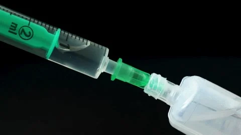 Background Using modern drugs Doctor preparing vaccine injection in modern Stock-Footage 336587480