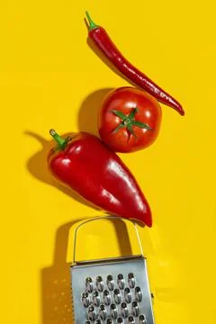 Background with vegetables and kitchen tools on a yellow table. Ingredients.  Stock Photos