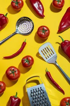 Background with vegetables and kitchen tools on a yellow table. Ingredients.  Stock Photos