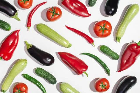 Background with vegetables on a white table. Ingredients. Food preparation. Stock Photos