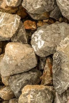 Background vertical rigid foundation weathered pile of stones design site Foto stock