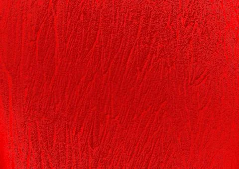 Background of a vibrant red wall with bumpy strokes on it 写真素材