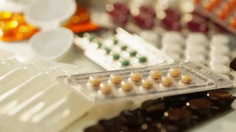 Background video close-up of packed medicine boxes with pills. Video stock 279565391