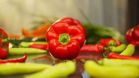 Background video of fresh organic red pepper falling on the table. Stock Footage 296361963