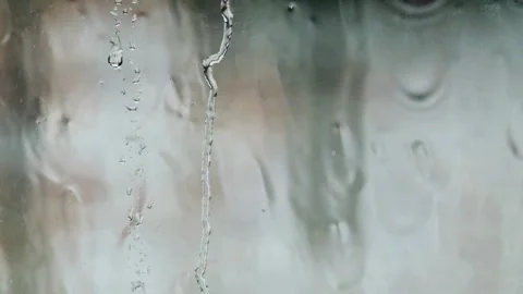 Background video of rainwater flowing on transparent window glass Stock Footage 319880445