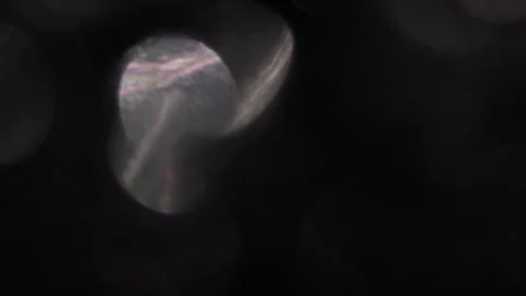 Background video of white bokeh particles moving in black facing right Видео 317453102
