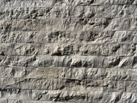 Background wall made of grey black and white bricks with straight lines and Stock Photos