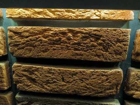 Background of a wall made of ochre bricks. Stock Photos