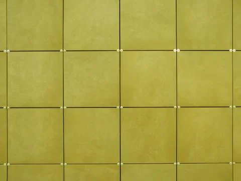 Background of wall  made of yellow square tiles Stock Photos