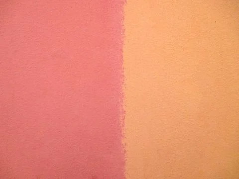 Background from the wall in pink and yellow. Stock Photos