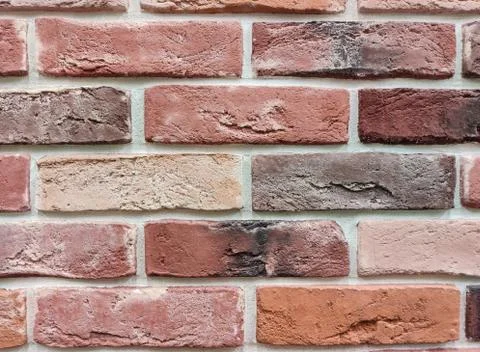 The background of the wall is a red brick surface. Abstract wall background Stock Photos
