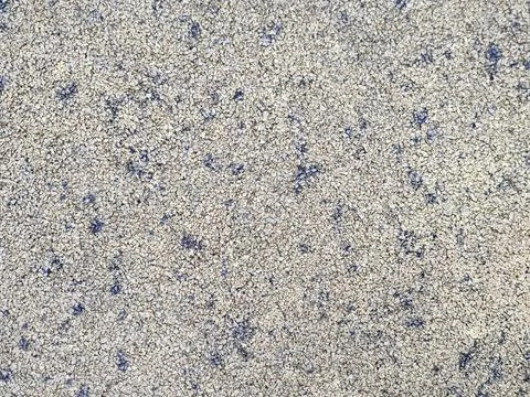 Background wall of small stone with blue splashes Stock Photos