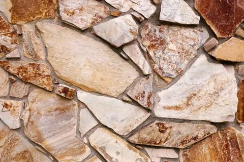 Background Wall of Textured Stone Siding from the 1970's Stock Photos
