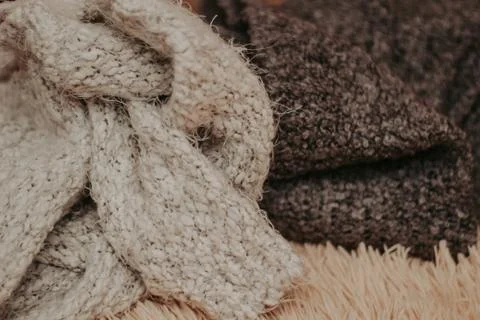 Background with warm sweaters. Pile of knitted clothes, warm background, knit Stock-Fotos