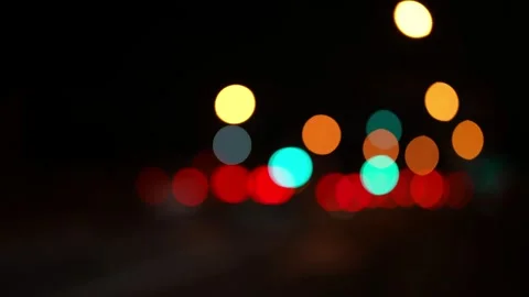 Background of washed bokeh lights of passing cars at night Stock Footage 165135428