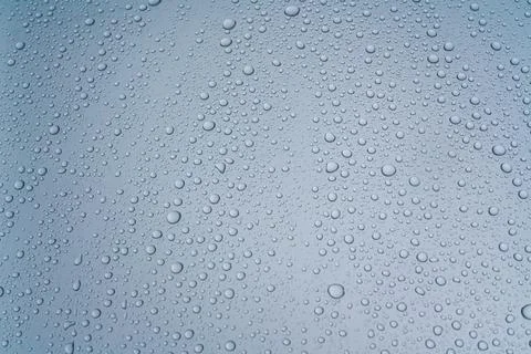 Background - water droplets on the surface of light blue color Foto stock