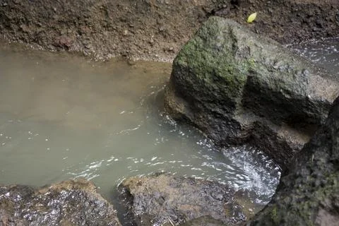 Background of water flow between rocks. Good illustration for nature and coun Stock Photos