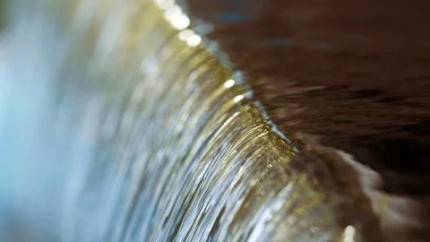 Background with water flow close-up. Clear water stream, quiet waterfall. Stock Footage 117135120