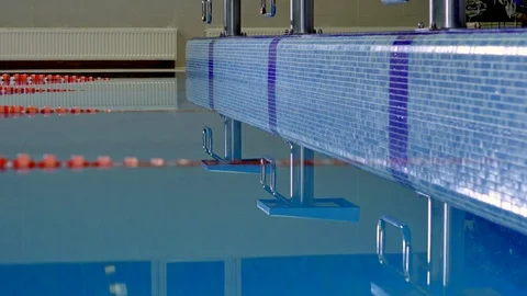 Background waves and reflections in the pool water before the competition Stock Footage 99229613