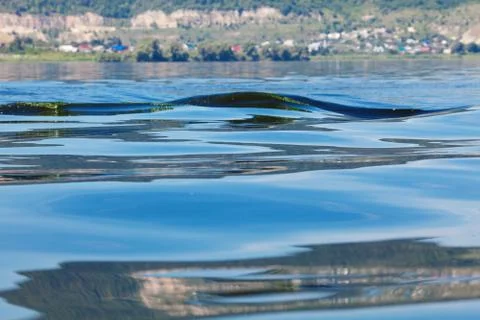 Background of waves on the river and mountains Stock Photos