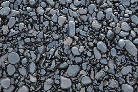 Background of wet black pebbles Stock Photos