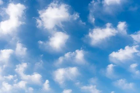 Background of white clouds in a blue sky, clouds leaving traces by the action Stock Photos
