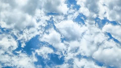 Background of white fluffy clouds on background sky Stock Photos