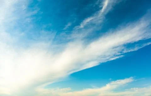 Background white fluffy clouds in the blue sky Stock Photos
