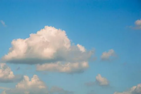 Background of white fluffy clouds in the blue sky.Close up Stock Photos