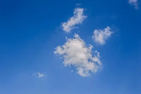 Background of white fluffy clouds in the blue sky.Close up Stock Photos