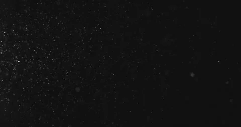 Background. White particles move chaotically on a black background. Snow. Dust Stock Footage 312148206