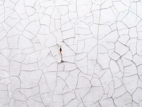 Background of a white surface in cracks 스톡 사진