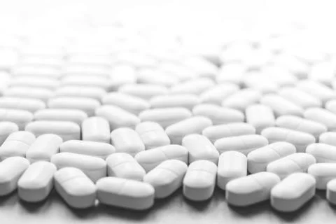 Background of white tablets on the table Stock Photos