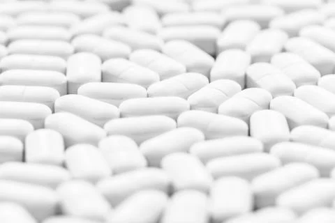 Background of white tablets on the table Stock Photos